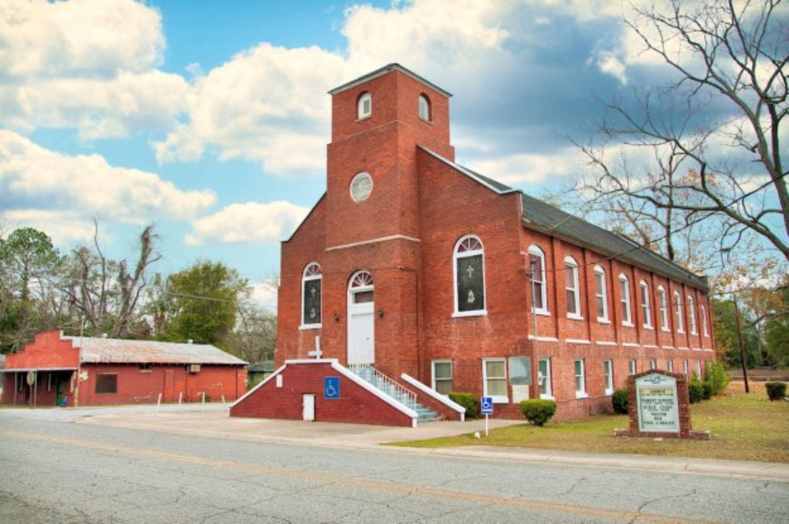 The historic red-brick sanctuary of St. John's Missionary Baptist Church in Waycross, Georgia